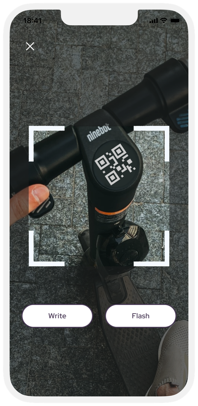 Scanning the QR code on a scooter's handlebar